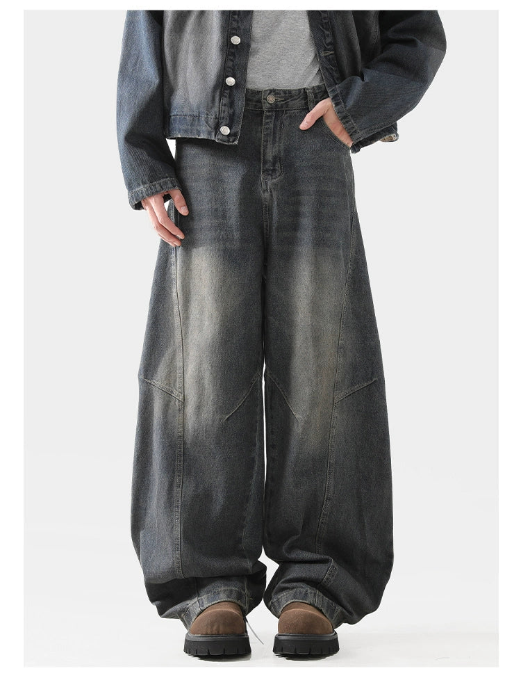 Baggy scimitar-style dark blue black vintage coloured washed jeans